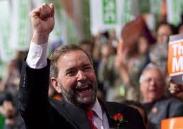NDP leader Mulcair with clenched fist. 